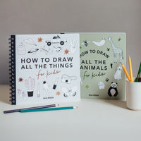 Two books titled 'How to Draw All the Things for Kids' and 'How to Draw All the Animals for Kids' on a white surface with pencils.