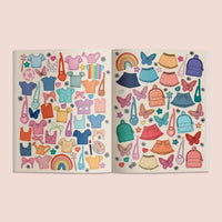 Interior spread from “My Sticker Storybook: Fairies & Unicorns” featuring colorful dress-up stickers, including tops, skirts, purses, backpacks, butterflies, and rainbows on a soft pink background