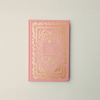 Pink book with gold decorative elements and 'Aunt's Story' text on a light gray background