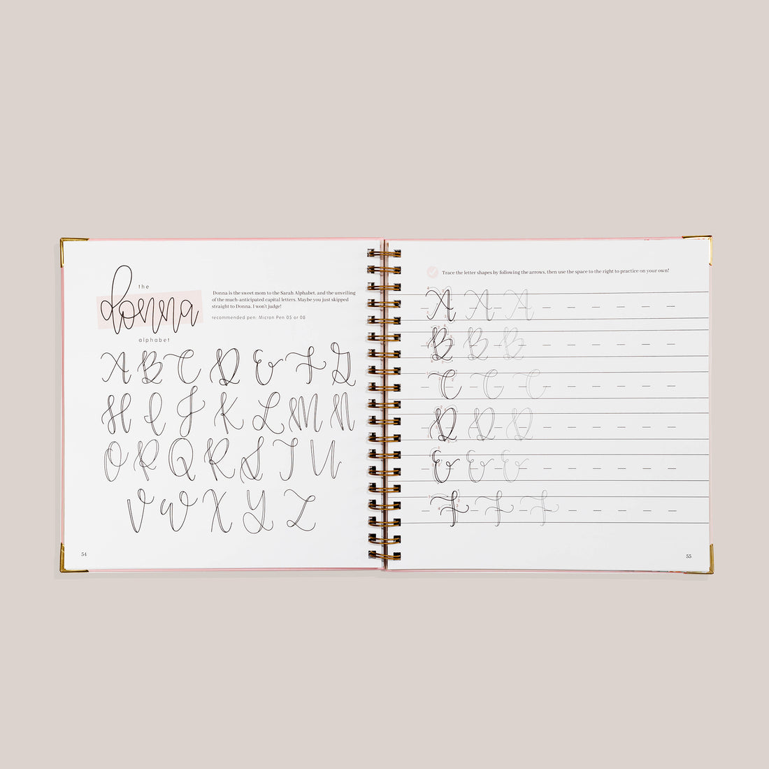 Open view of 'Modern Calligraphy' with calligraphy practice pages on a beige background