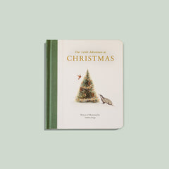 Book titled 'Our Little Adventure at Christmas' with a Christmas tree and reindeer illustration on a light green background.