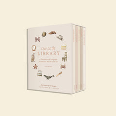 Designed by a professional watercolor artist and licensed speech therapist, Our Little Library Vol. 2 includes five new board books that feature charming watercolor illustrations and foundational first words that will help you build your child's vocabulary. The durable materials and small book size also make them perfect for your baby's little hands.  The box has several water color images on it in a circl showing items like a brush, chair, bow, bed, etc. 