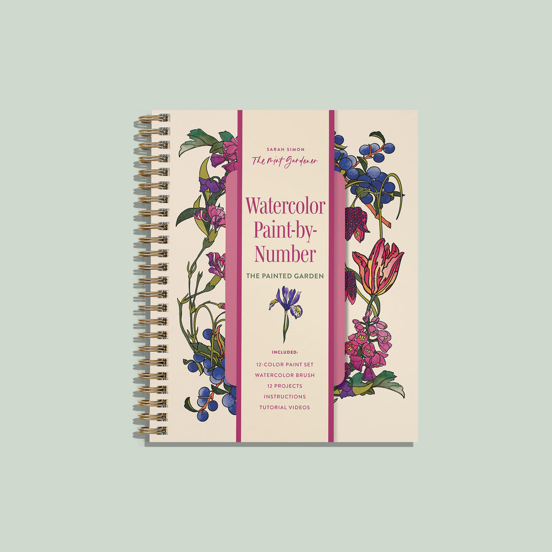 A spiral-bound art book titled 'Watercolor Paint-by-Number: The Painted Garden' by Sarah Connor, featuring a cream cover with pink text and pink vertical stripes, decorated with watercolor illustrations of flowers and berries. The book is centered on a solid sage green background.