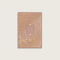 Book titled 'Aunt's Story' with decorative gold design on a light gray background