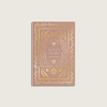 Book titled 'Aunt's Story' with decorative gold design on a light gray background