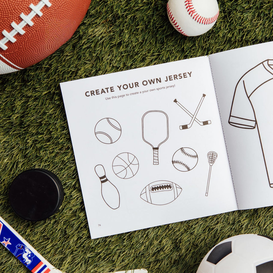 Children's activity book with sports-themed designs on grass with sports equipment.