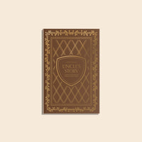 Book titled 'Uncles Story' with decorative cover on a beige background