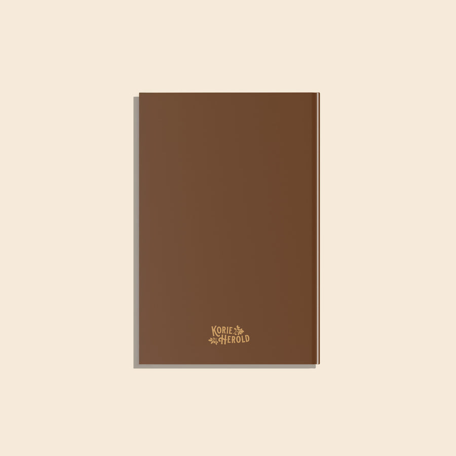 Brown notebook with a brand logo on a beige background