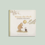 Book titled 'Winnie-the-Pooh Finding Feelings' with illustrations of Pooh and Piglet on a light green background