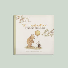 Book titled 'Winnie-the-Pooh Finding Feelings' with illustrations of Pooh and Piglet on a light green background