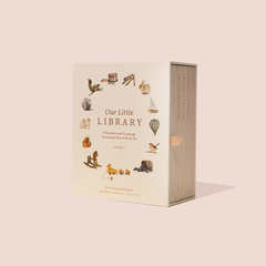 A boxed set of five board books titled 'Our Little Library' with illustrations of animals, fruits, vegetables, toys, and transportation on the covers, designed for babies and toddlers.