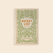 Book cover of "Our Bucket List Adventures" has a beige cloth cover with green leafy designs and a gold lettering. 
